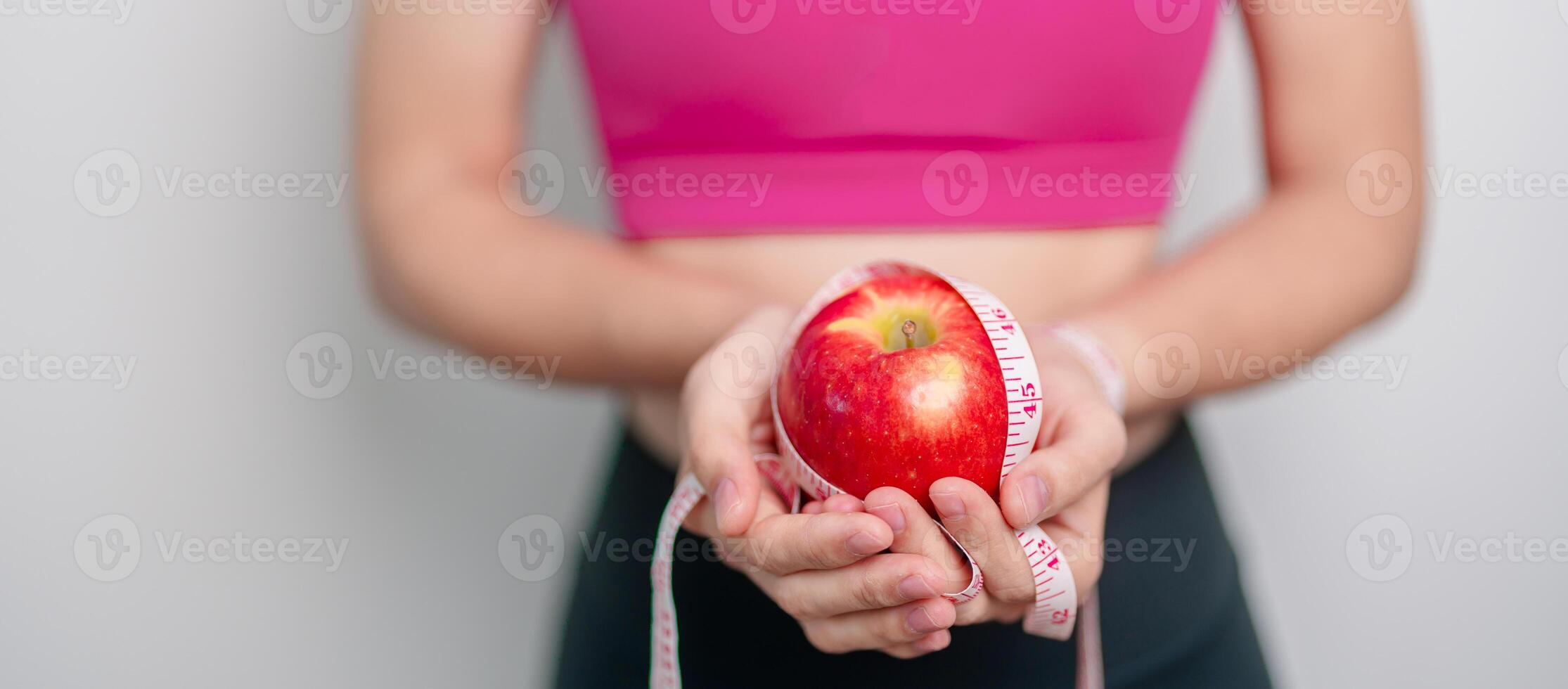 woman hand hold red Apple, happy female fitness choose fruit is Healthy food. Dieting control, Weight loss, Obesity, eating lifestyle and nutrition concepts photo