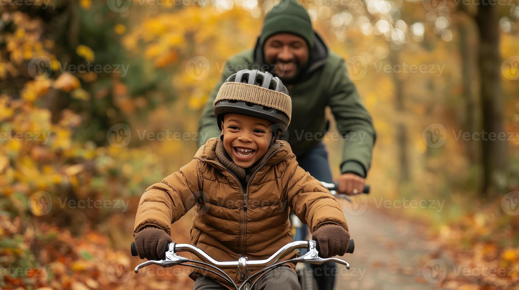Joyful Father and Son Riding Bike on Autumn Forest Path photo