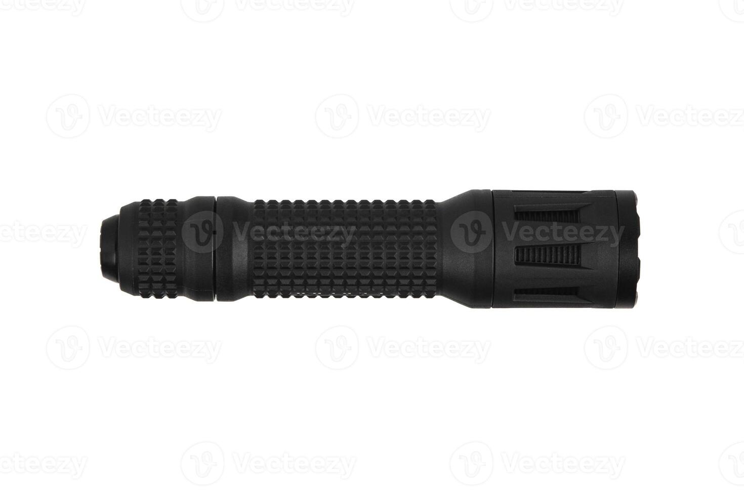 Black metal LED flashlight isolate on a white back. Pocket lamp for dark time of day or dark rooms. photo
