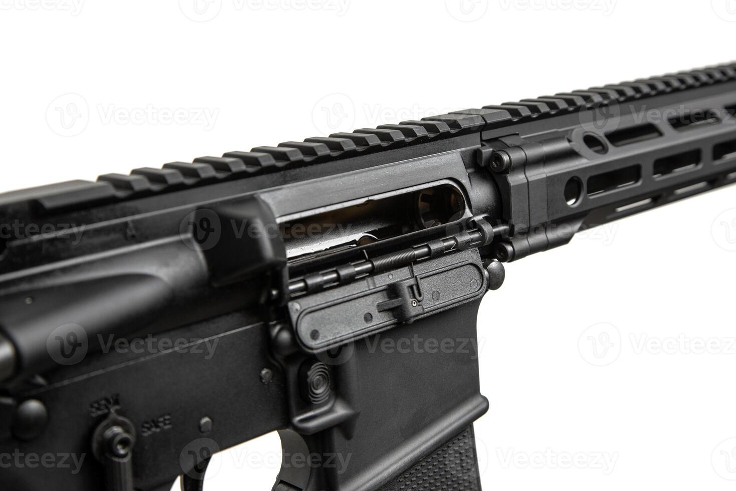 Close-up of the open bolt cover. A modern automatic carbine without sights and with an additional handle. Isolate on a white back photo