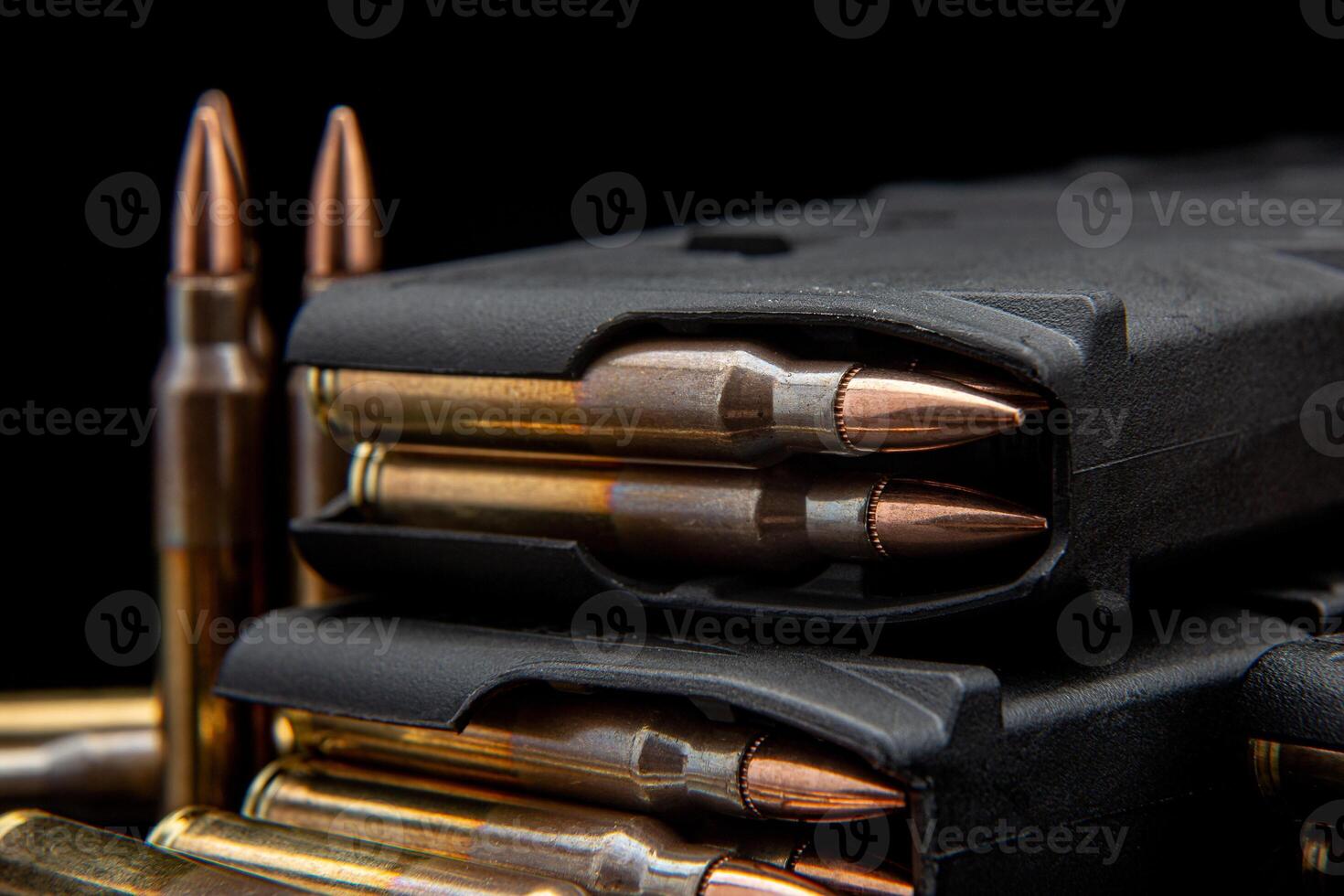 Bullet isolated on black background with reflexion. Rifle bullets close-up on black back. Cartridges for rifle and carbine on a black. photo