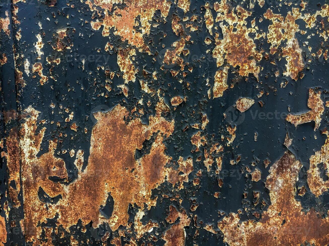 Metal rusty texture with cracked and shabby black paint photo