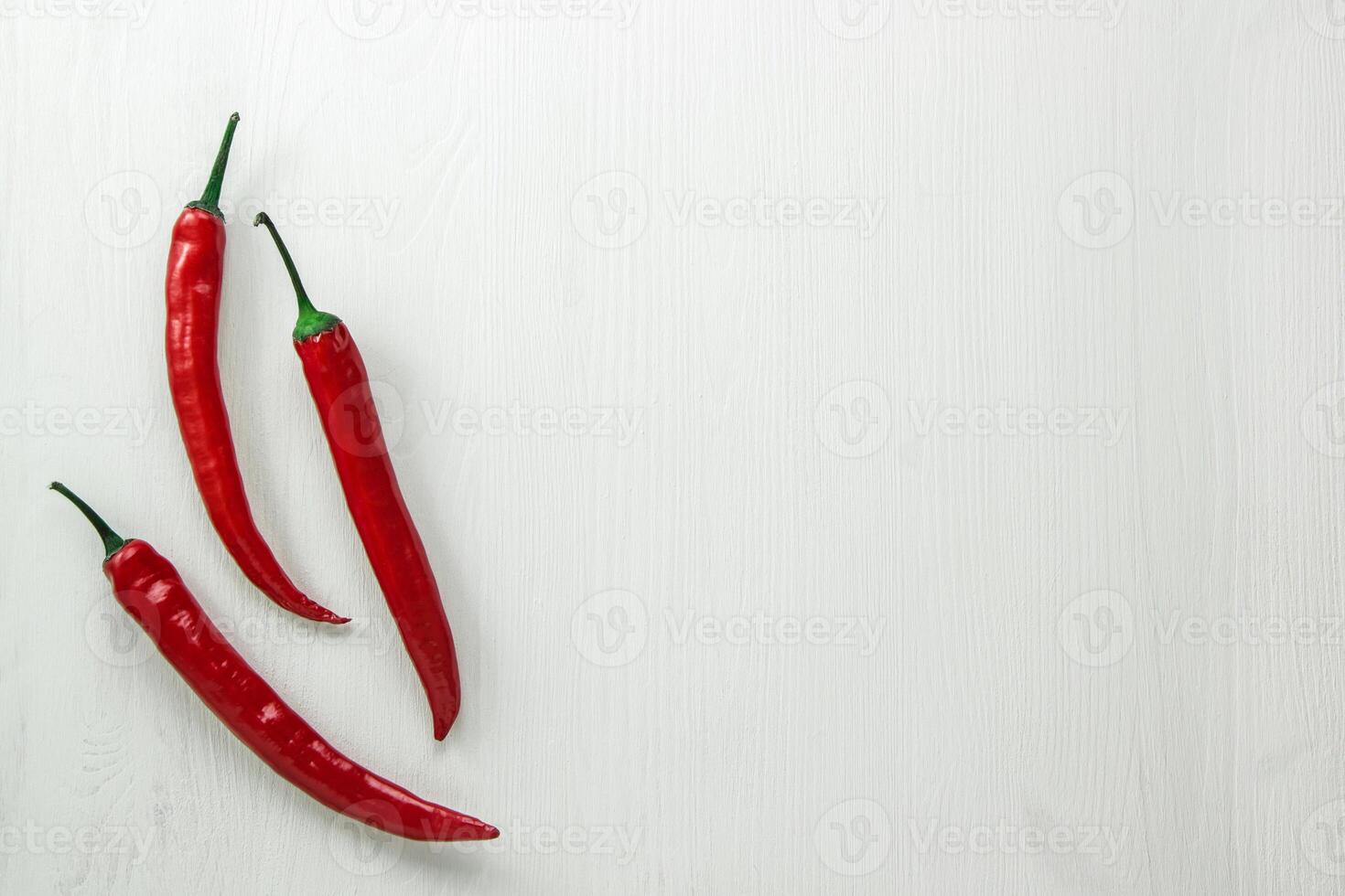 red hot peppers on a white background photo