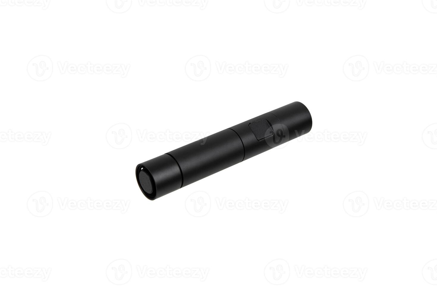 Modern metal LED flashlight in black color. Portable flashlight isolate on a white back photo