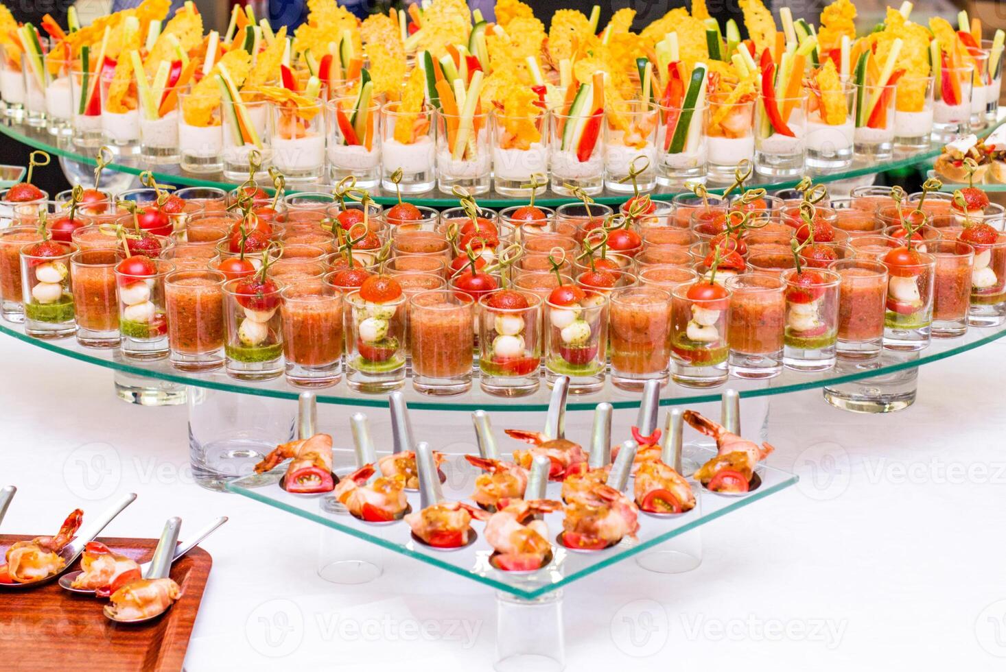 A variety of snacks, canapes and sandwiches on the table. photo