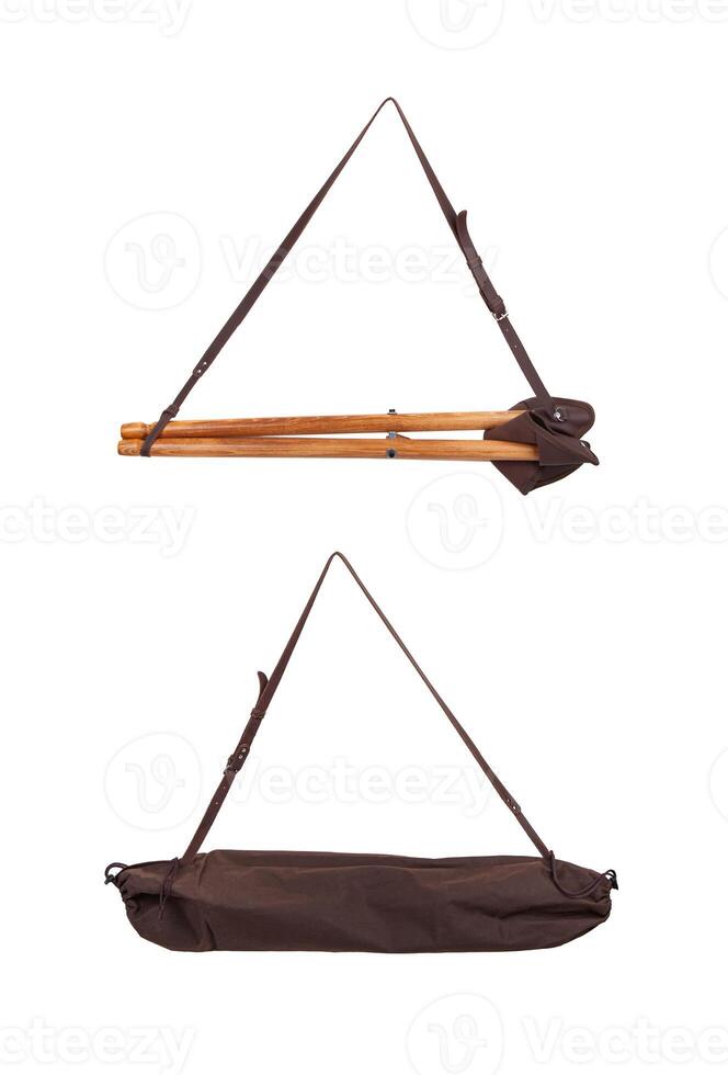 Folding wooden hunting stool tripod isolate on white background. Three-legged camping chair, Made of wood and leather. photo