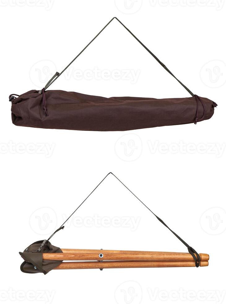 Folding wooden hunting stool tripod isolate on white background. Three-legged camping chair. photo