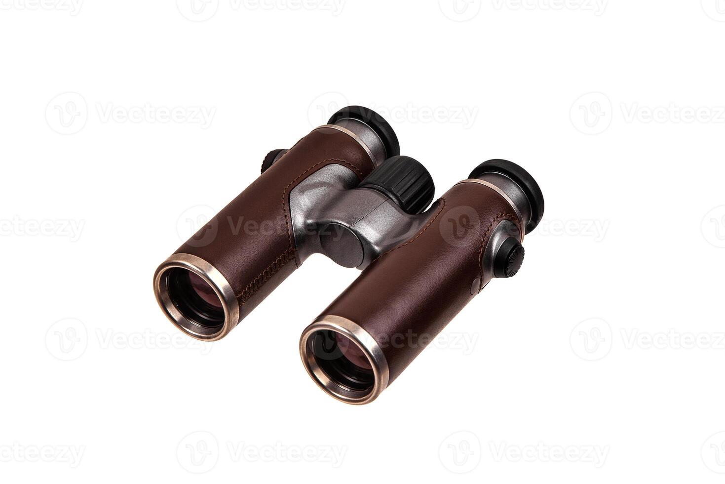 Modern luxury binoculars isolate on a white background. Silver binoculars with leather inserts. An expensive gift for a man. photo