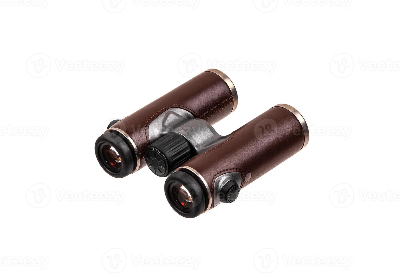 Modern luxury binoculars isolate on a white background. Silver binoculars with leather inserts. An expensive gift for a man. photo