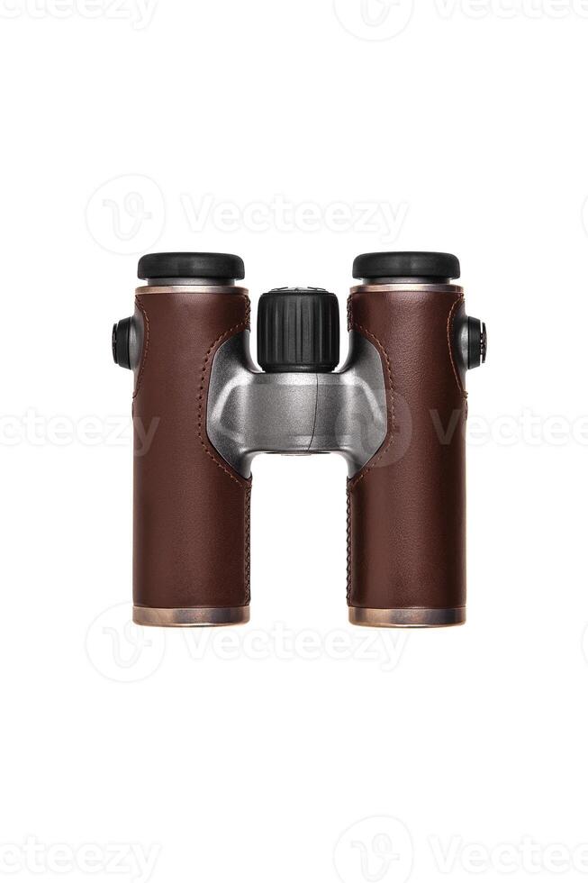 Modern luxury binoculars isolate on a white background. Silver binoculars with leather inserts. An expensive gift for a man. photo