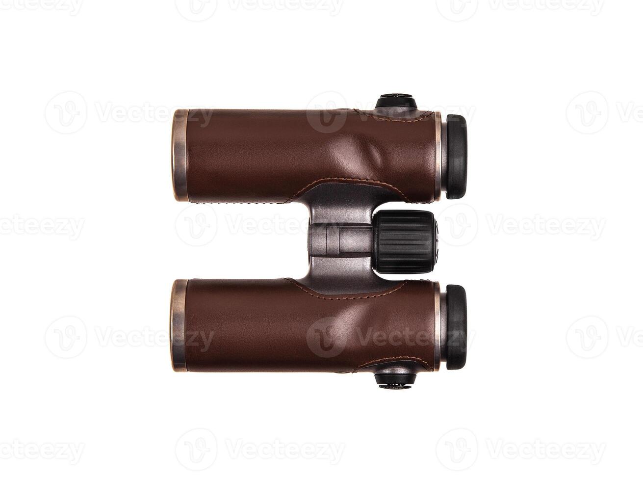 Modern luxury binoculars isolate on a white background. Silver binoculars with leather inserts. An expensive gift for a man. photo
