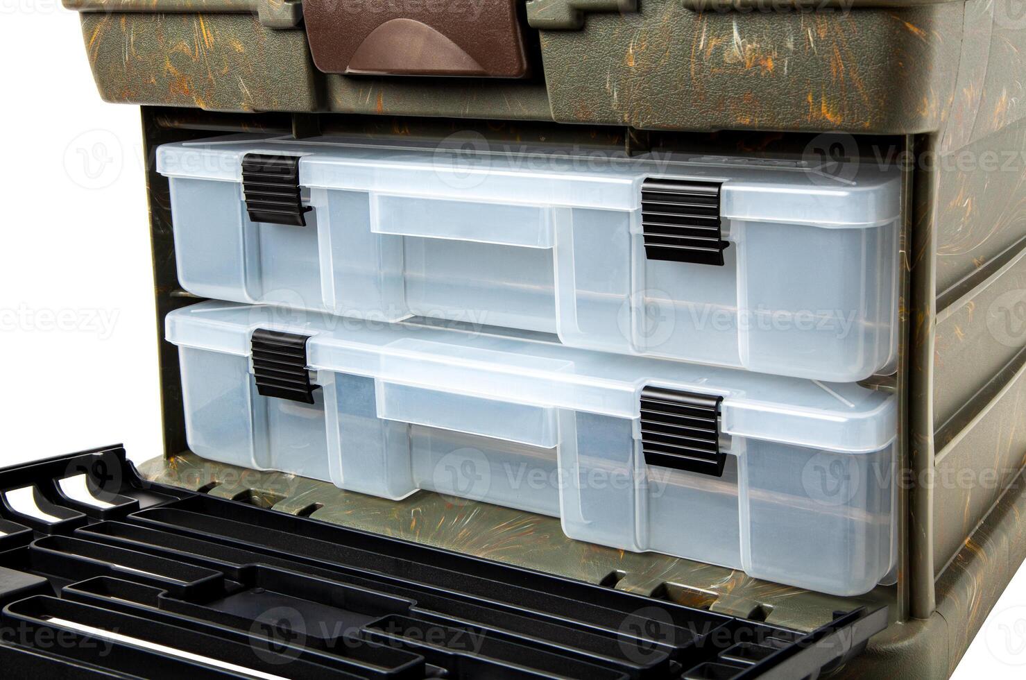 Portable plastic container with opening lid and additional sliding compartments. Fishing or hunting box. Isolate on a white back. photo