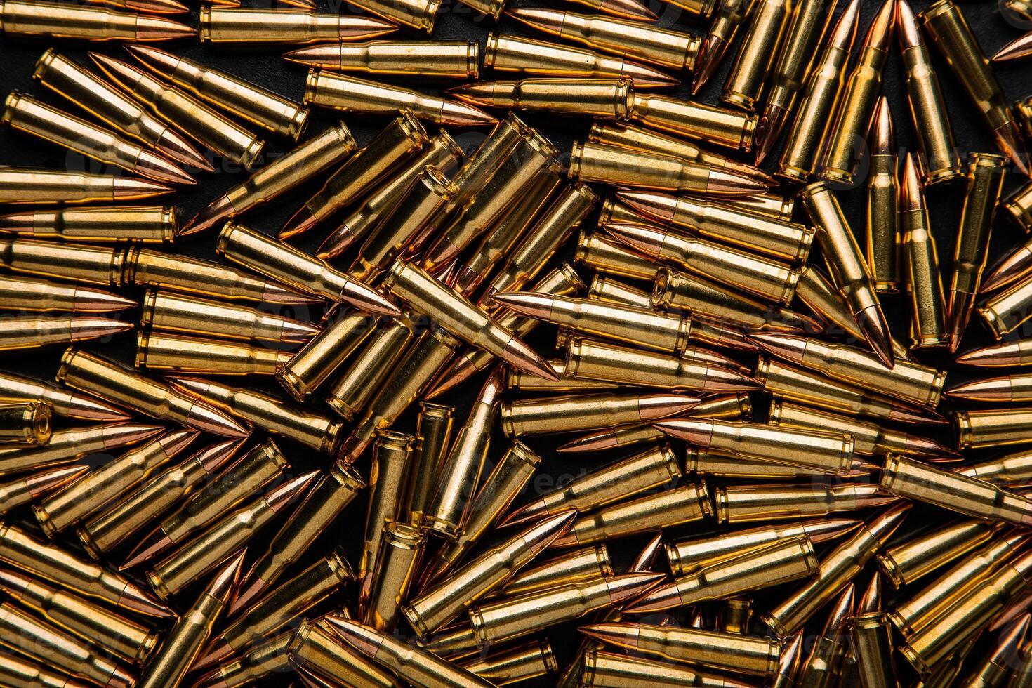 Background from cartridges for a carbine. Ammunition for modern weapons. photo