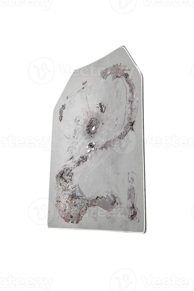 The metal plate of the bulletproof vest pierced by a bullet. Isolate on a white back. photo