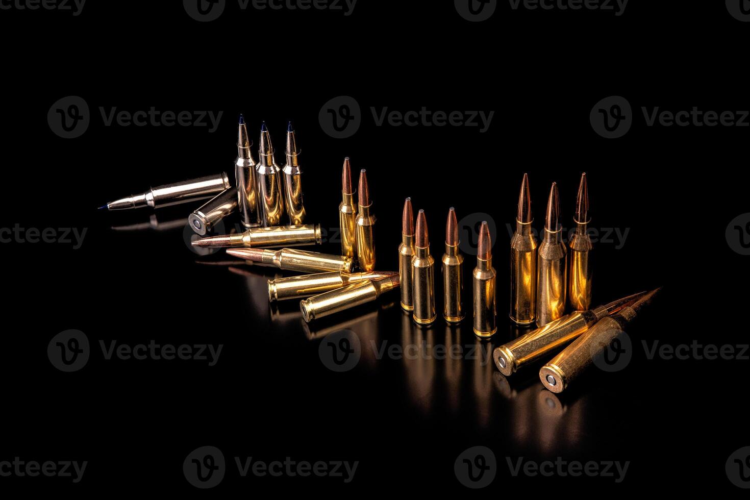 Bullet isolated on black background with reflexion. Rifle bullets close-up on black back. Cartridges for rifle and carbine on a black. photo