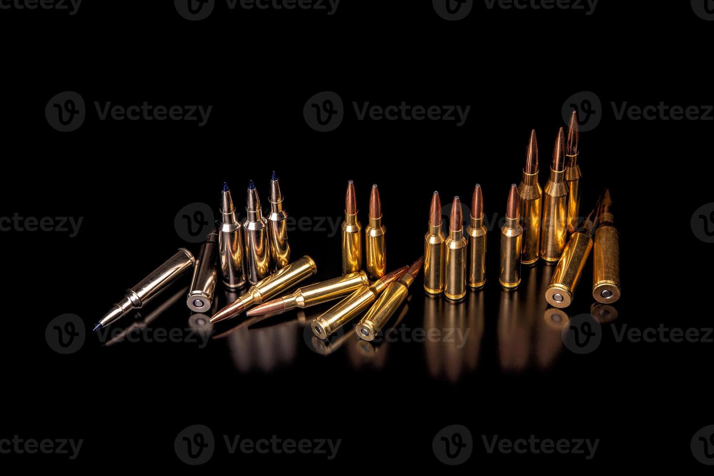 Bullet isolated on black background with reflexion. Rifle bullets close-up on black back. Cartridges for rifle and carbine on a black. photo