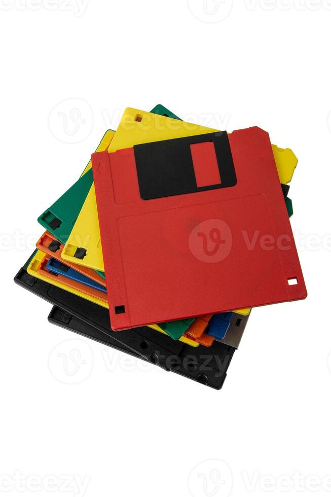 Multi-colored 3.5 floppy disks. Obsolete magnetic storage medium. Isolate on a white back. photo
