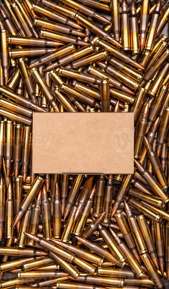 Background from cartridges for a carbine. A box of cartridges. Ammunition for modern weapons photo