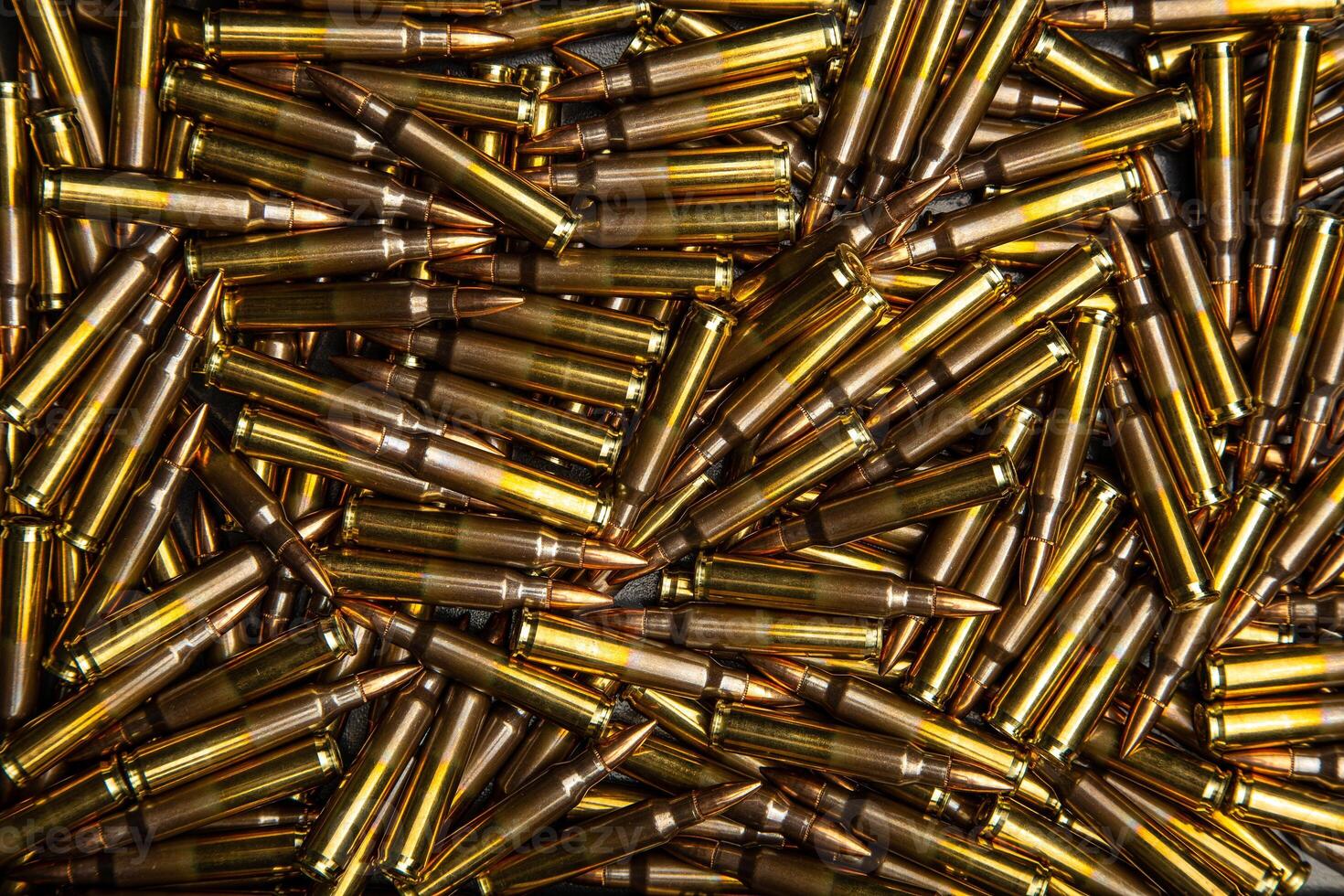Background from cartridges for a carbine. Ammunition for modern weapons photo