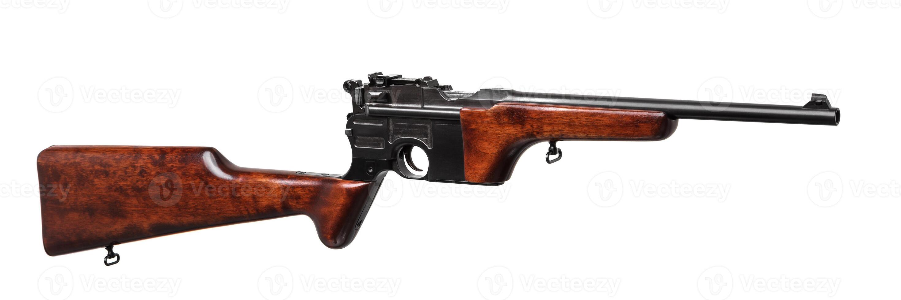 vintage pistol with a wooden handle. gun isolated on white photo