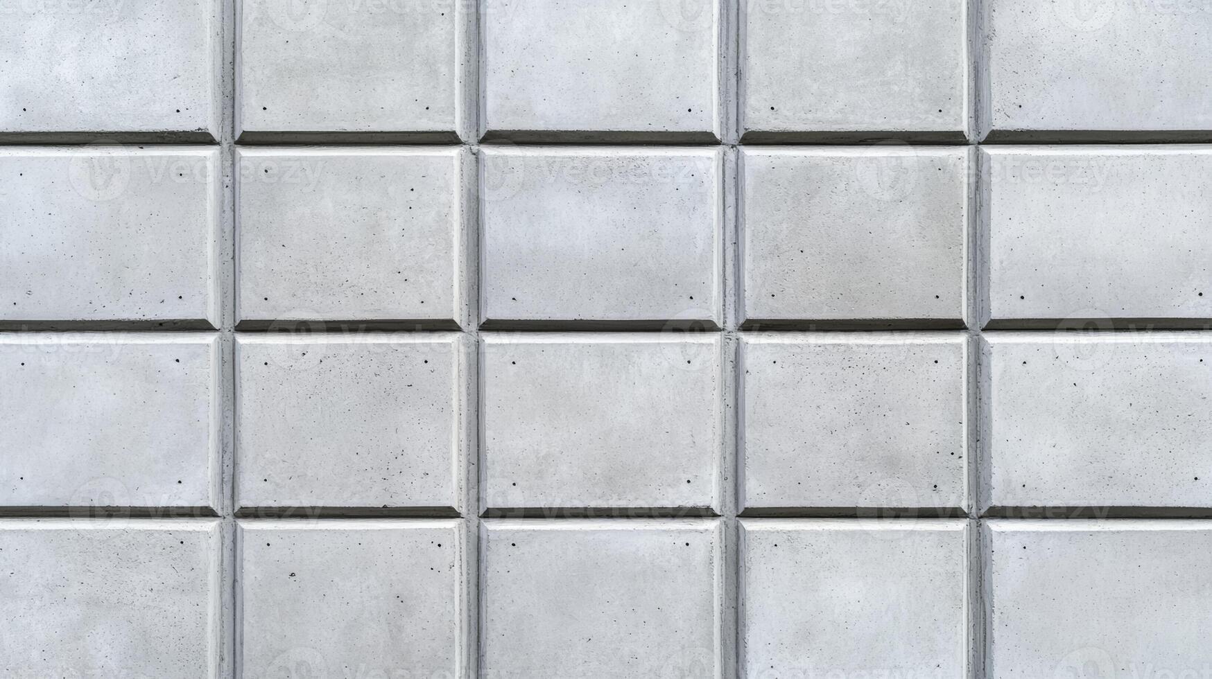 Closeup of a plain concrete wall in soft natural light smooth texture with faint gradients in light gray suitable for clean and modern aesthetic designs photo