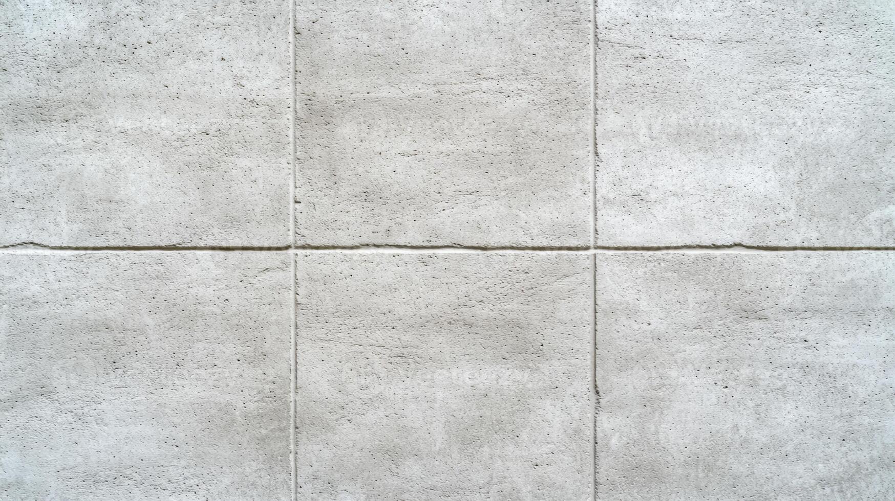 Closeup of a plain concrete wall in soft natural light smooth texture with faint gradients in light gray suitable for clean and modern aesthetic designs photo