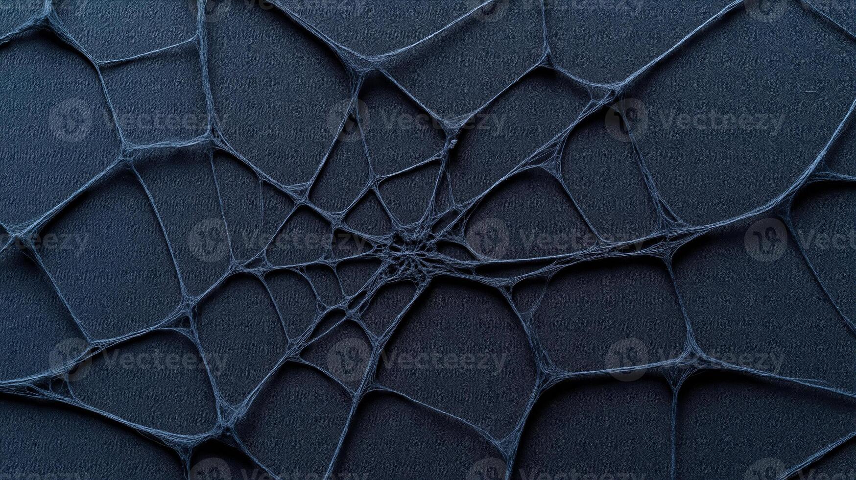 Spooky spiderweb texture on black rough fabric dark Halloween background eerie and mysterious ideal for haunting designs photo