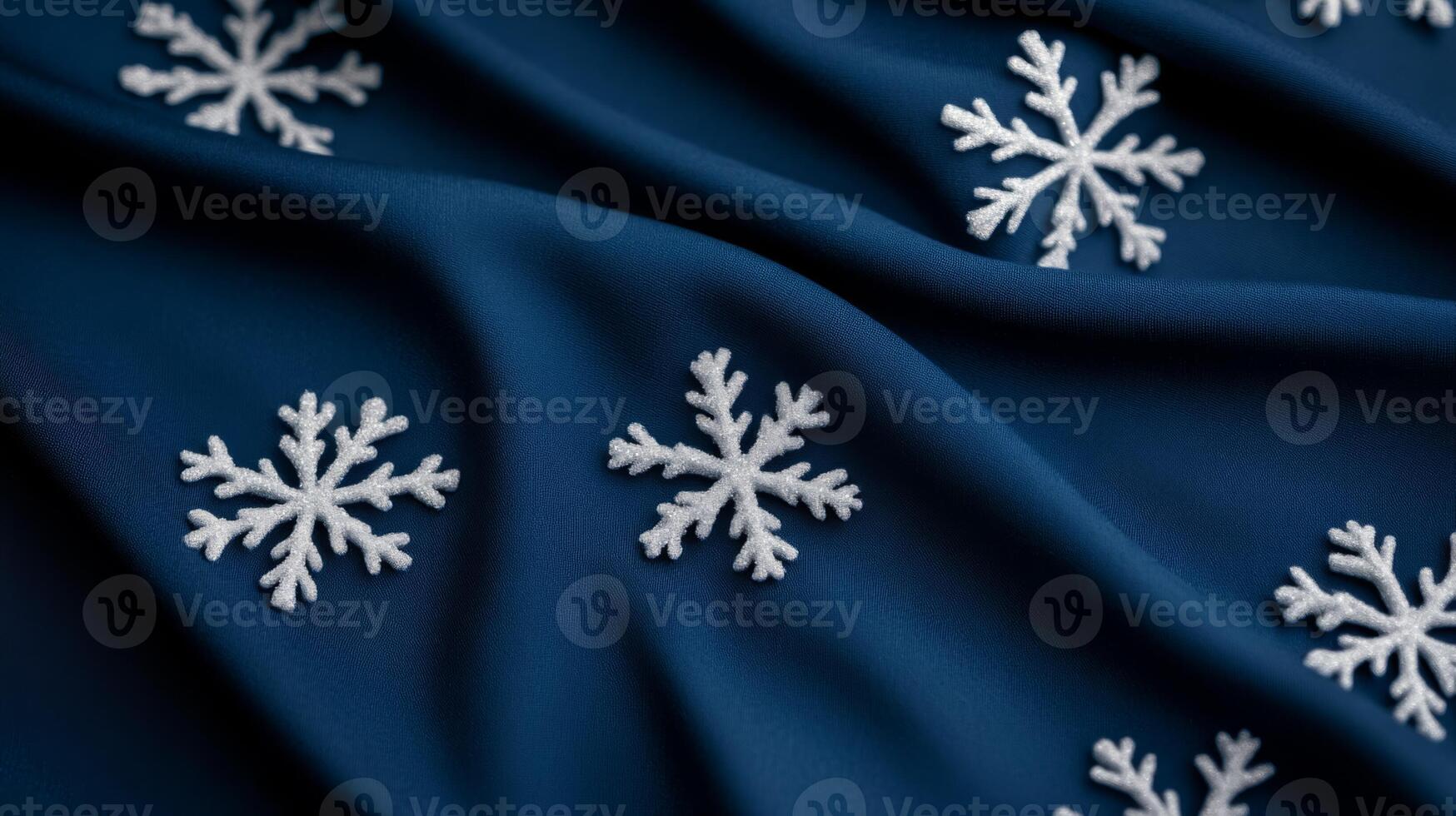 Dark midnight blue fabric background with faint glowing snowflake patterns scattered in an elegant winter Christmas holiday design smooth and cozy feel highlighting seasonal joy and tranquility photo