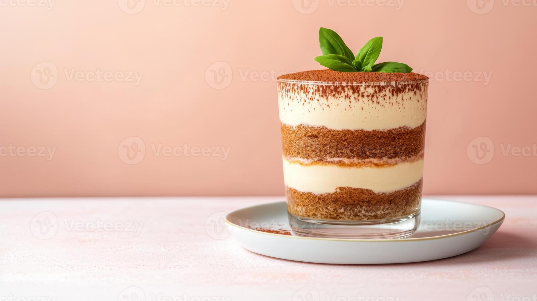 Exquisite dessert of layered tiramisu in a glass, dusted with cocoa powder, placed on a white plate with clear empty space for text, warm gradient background photo