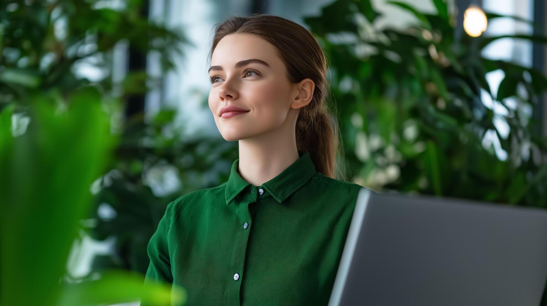 Joyful employee using a standing desk in a modern office plants and sunlight abundant wellness focused environment designed for comfort and mental clarity photo