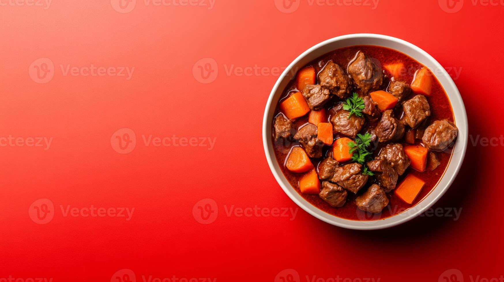 Plate of hearty goulash with tender beef, root vegetables, and paprika, cozy autumn vibe against a background with a gradient from deep red to rustic brown photo