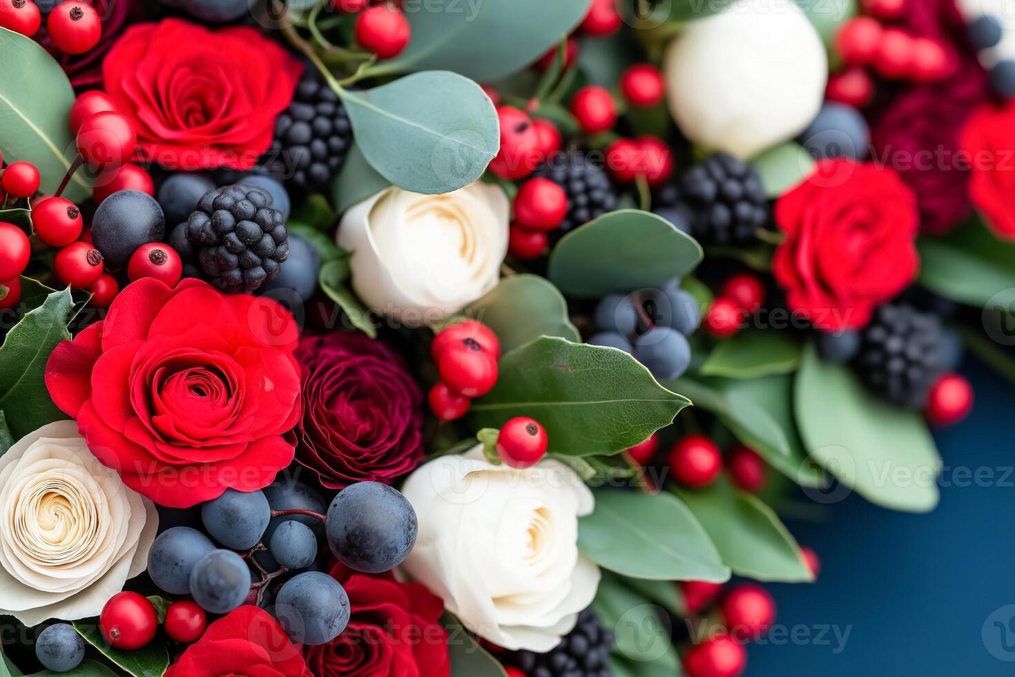 Seasonal Christmas and New Year plant and floral arrangements in the color palette of deep blue, vibrant red, pale yellow, and seafoam green photo