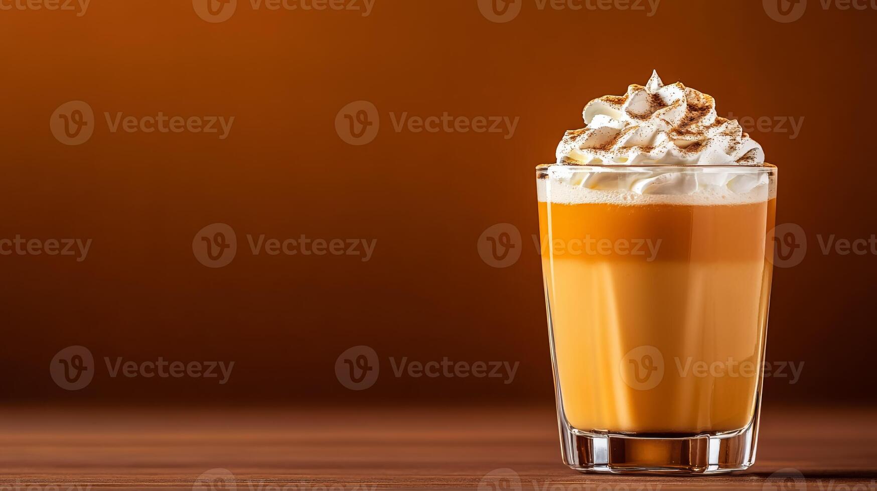 Seasonal pumpkin spice cocktail with rum and cream, garnished with whipped cream and nutmeg, served in a glass tumbler against a gradient background fading from burnt orange to dark brown photo