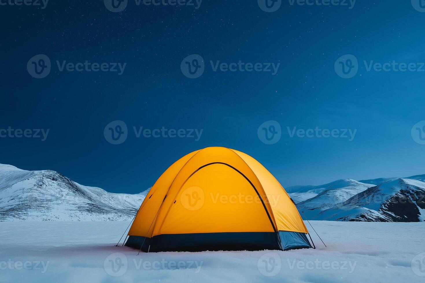 Tent nestled in snowy mountain landscape under a starlit sky photo