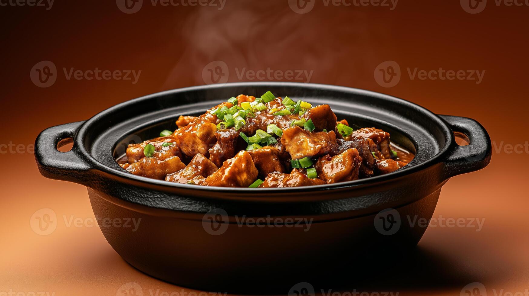 Vietnamese autumn dish of caramelized claypot fish with ginger and green onions, served with warm rice, set on a gradient background fading from deep orange to brown photo