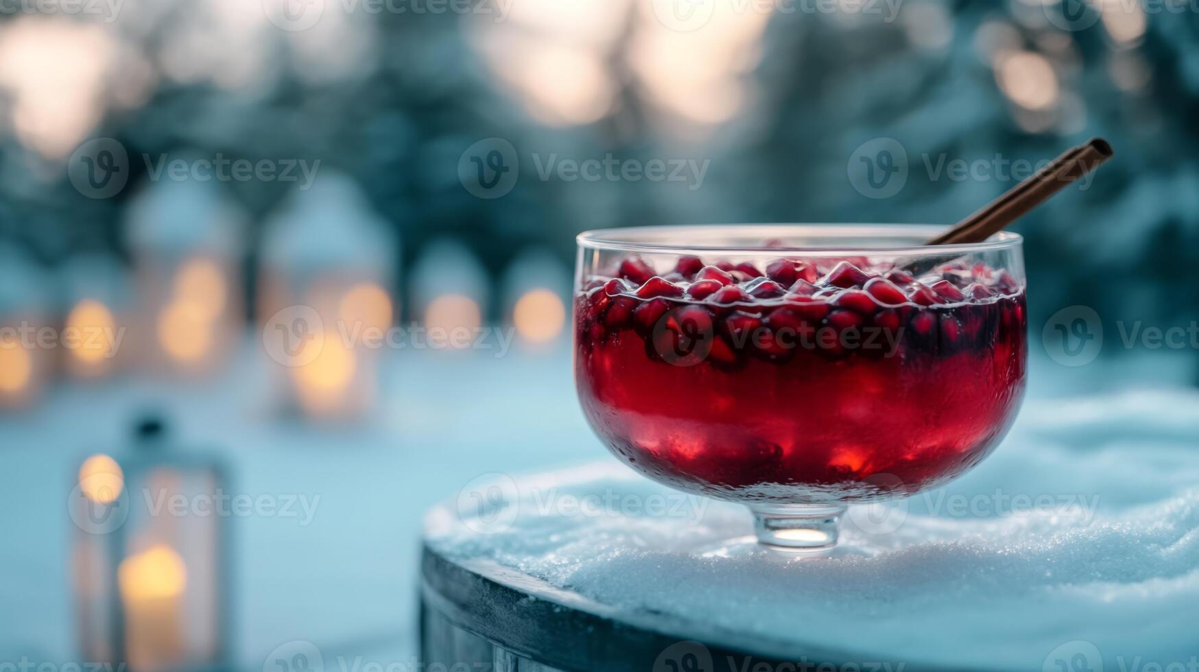 Winter punch with pomegranate seeds, cinnamon, and red wine, served in a large glass bowl with a ladle, snowy scene with icy window frost and softly glowing lanterns photo