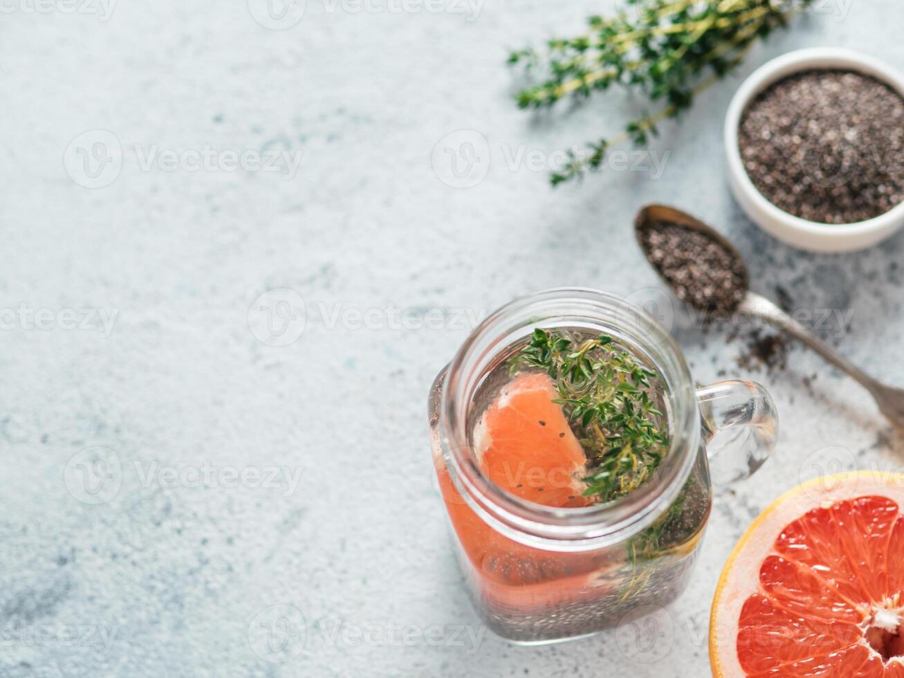 grapefruit and thyme chia water in mason jar photo