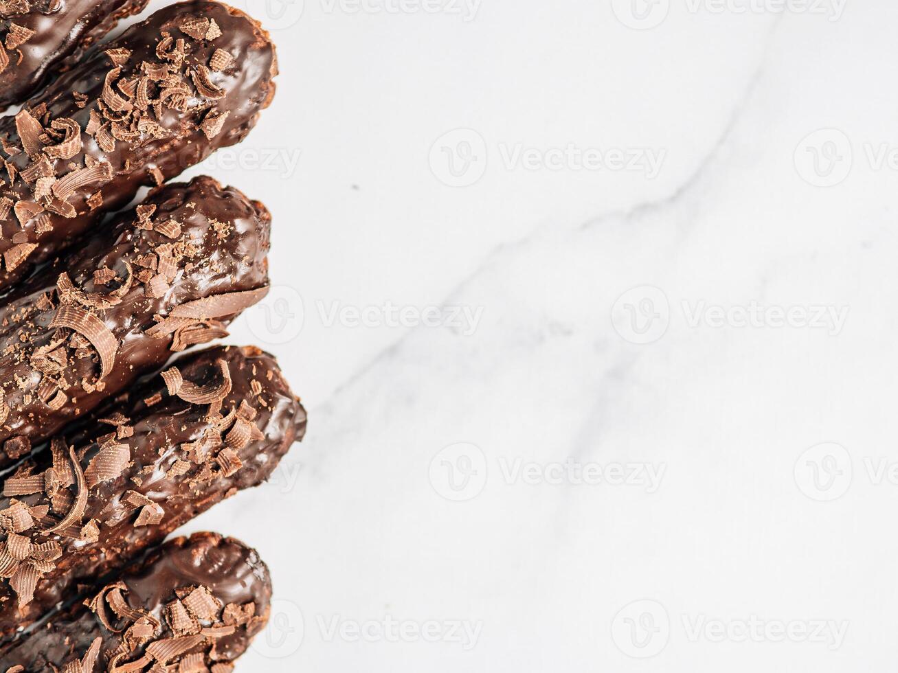 Healthy chocolate eclairs, copy space right photo