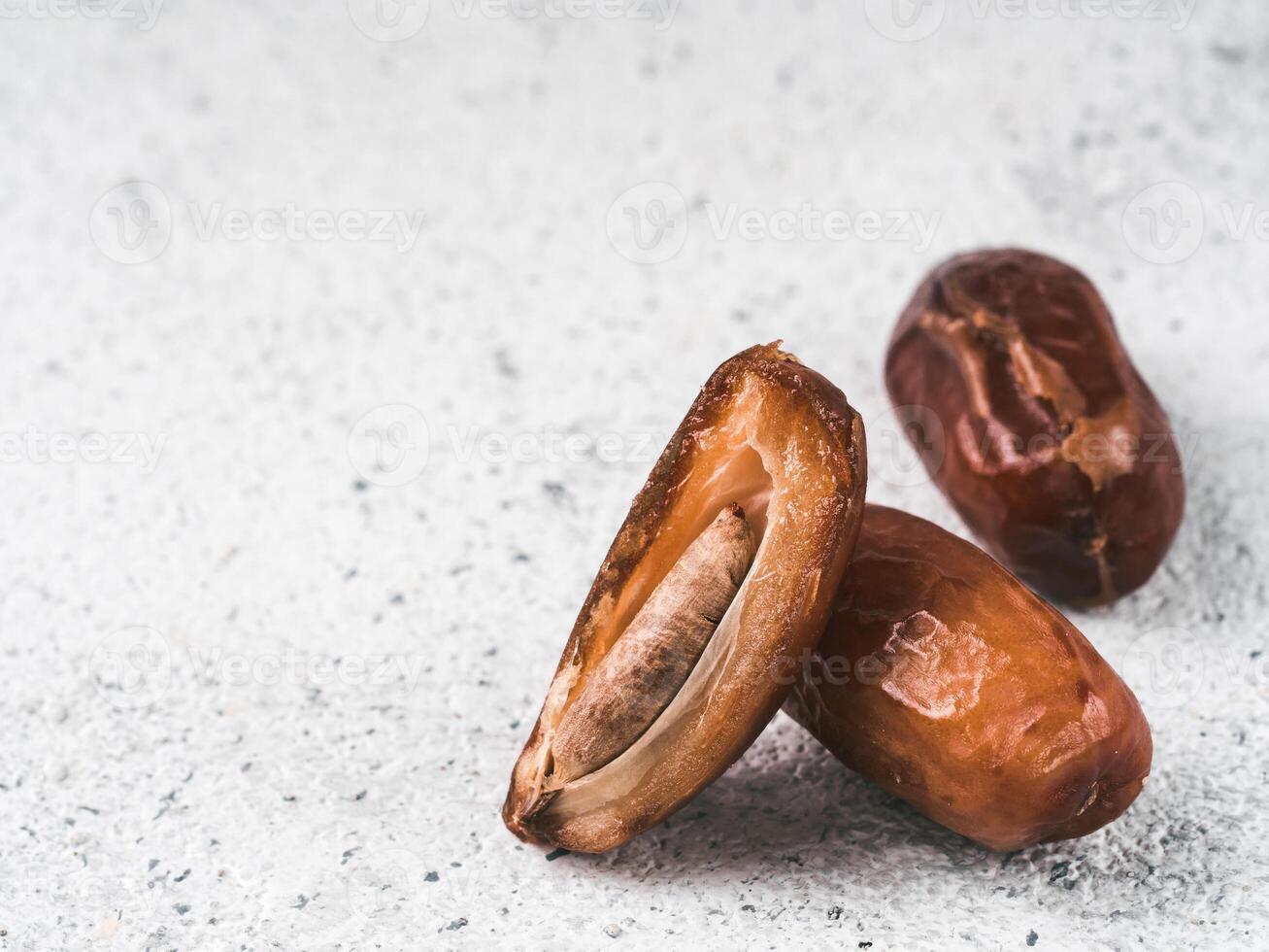 Dried dates on gray cement,copyspace photo