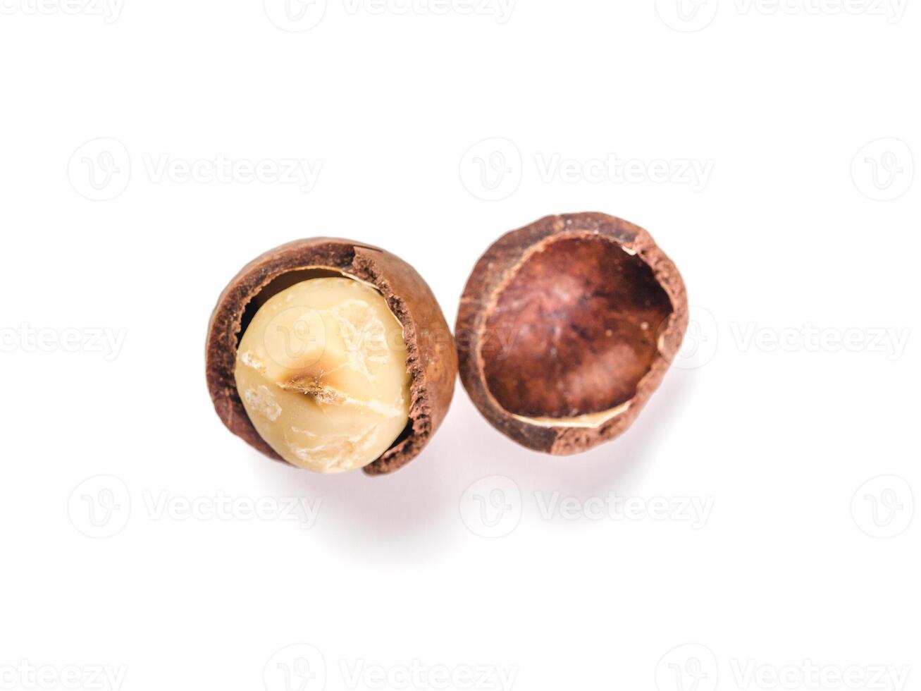 Macadamia nut with open shells, isolated, top view photo