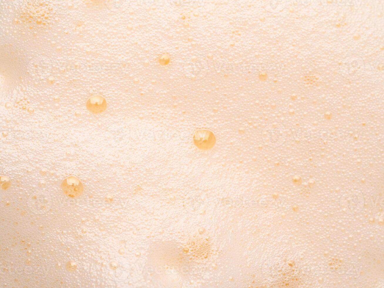 Beer or cappucino foam with bubbles texture photo