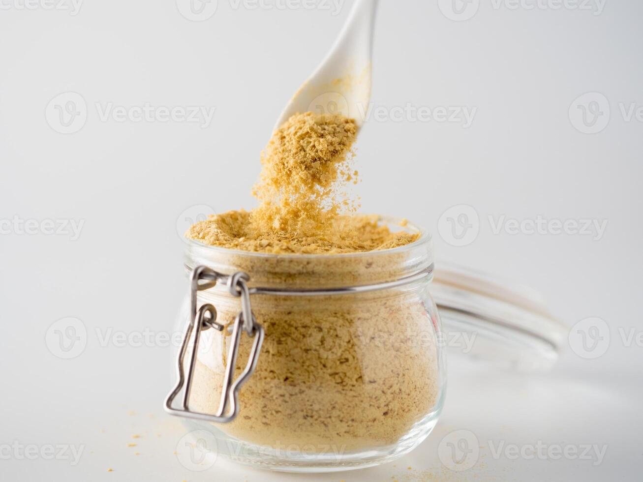 Nutritional inactive yeast in glass jar photo