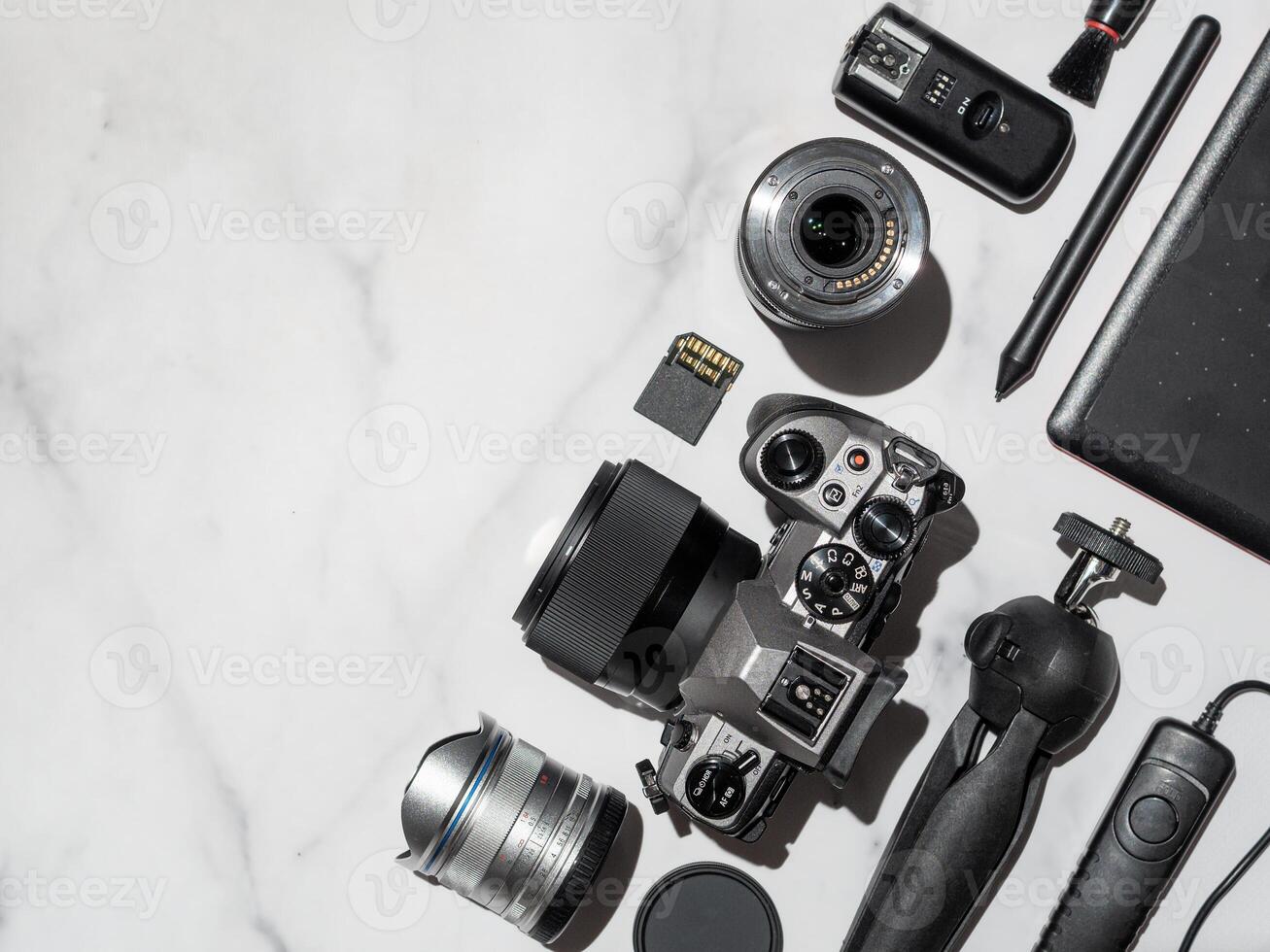 Camera and accessories on table, copy space photo