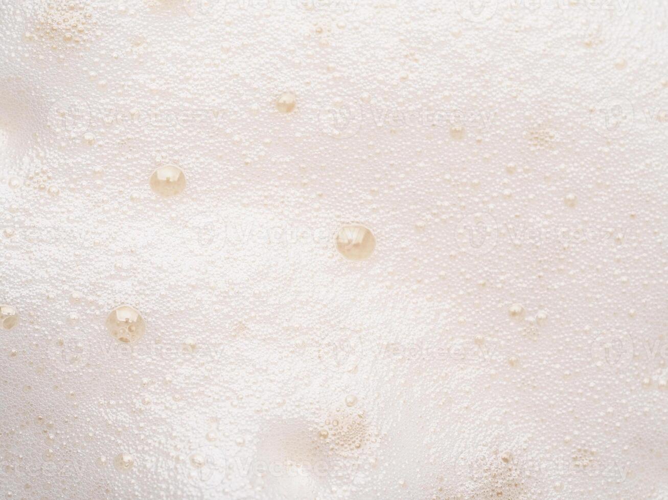 Beer or cappucino foam with bubbles texture photo