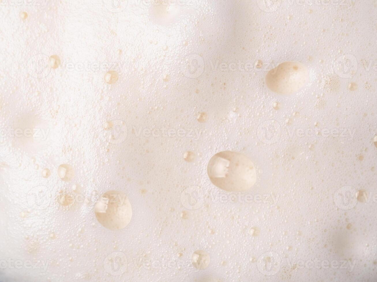 Beer or cappucino foam with bubbles texture photo