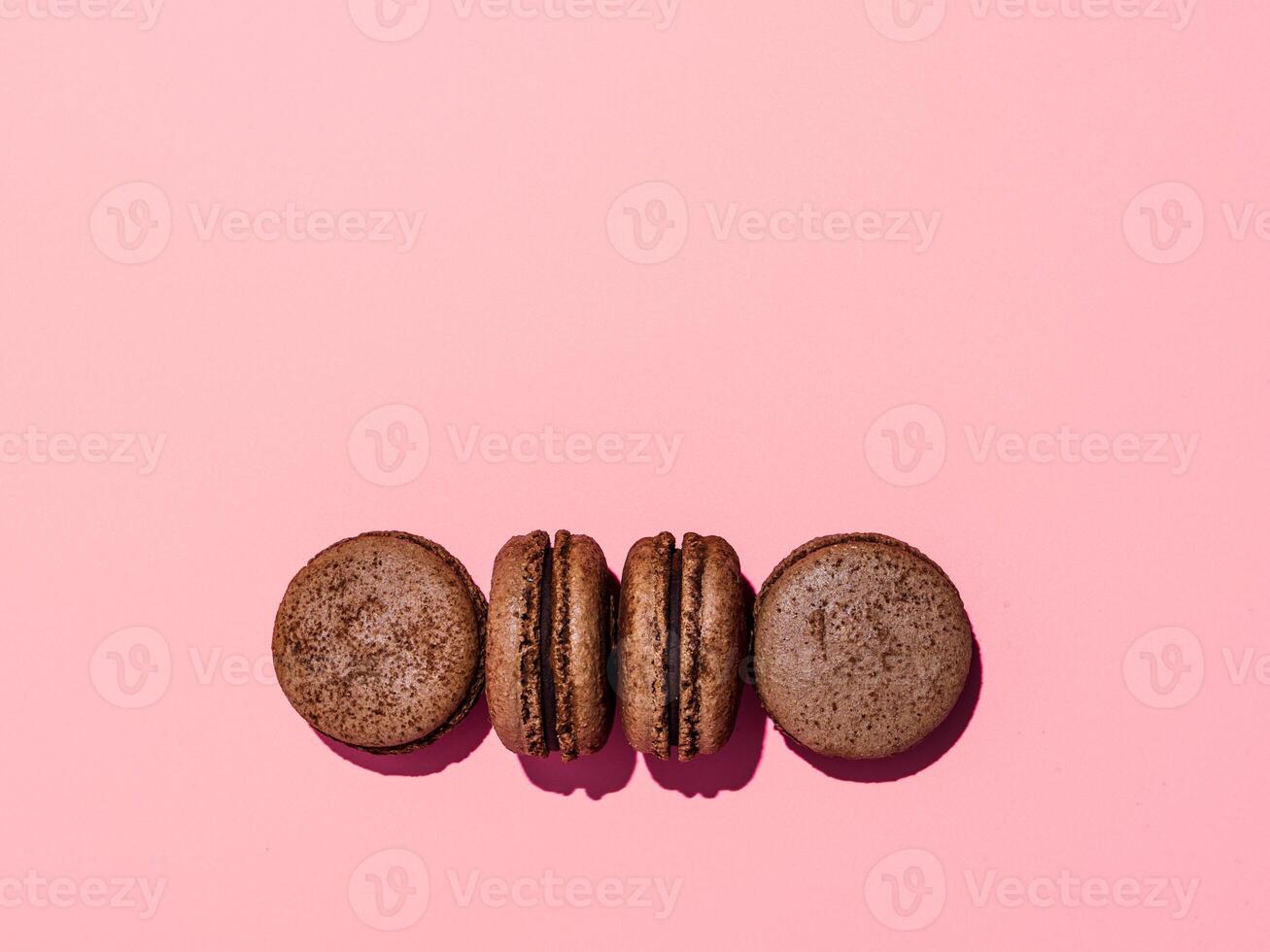 Macarons on pink, copy space, hard light photo