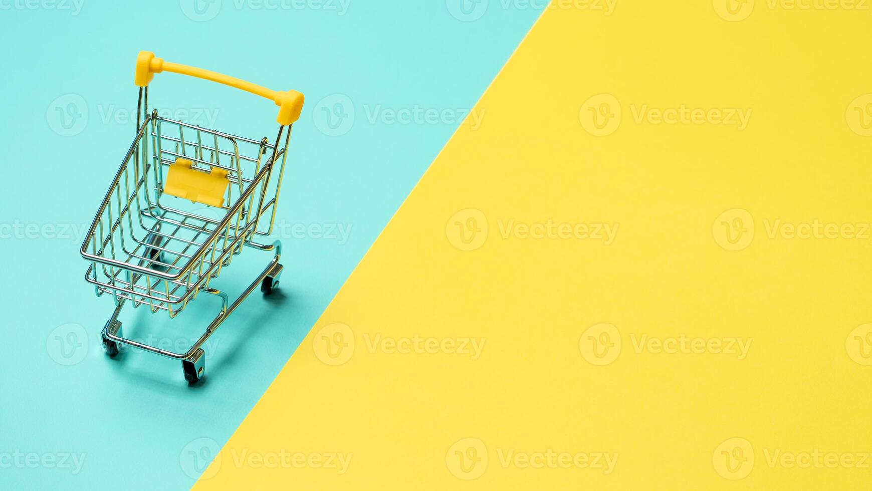 Empty inverted shopping cart, copy space photo
