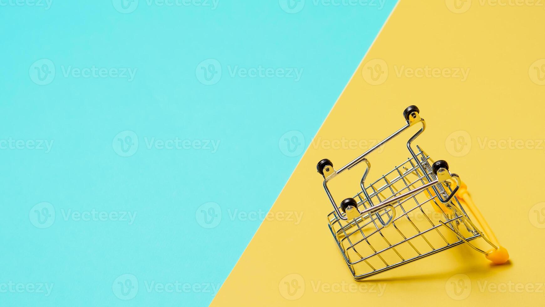 Empty inverted shopping cart, copy space photo
