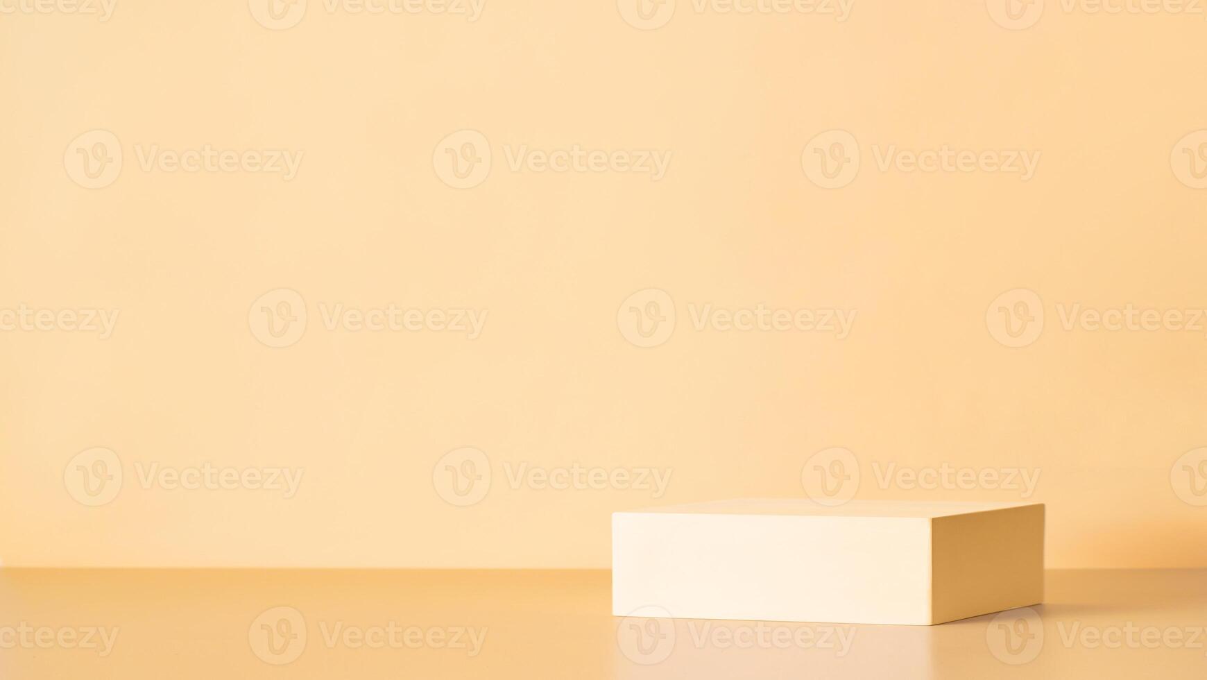 Light podium on yellow background photo