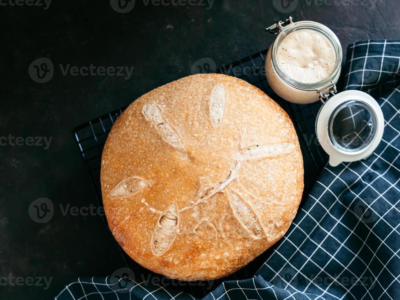 Wheat round sourdough bread, copy space, top view photo